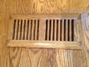 Wooden vent cover stained and sealed to match the hardwood floor