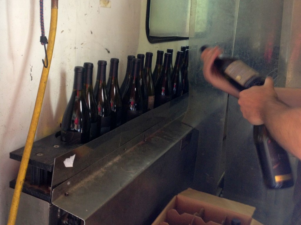 Finished, filled bottles leave the bottling operation