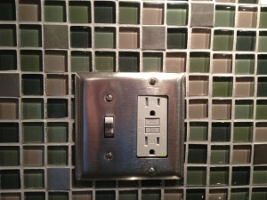 Stainless steel light switch/outlet cover which matched stainless steel tiles
