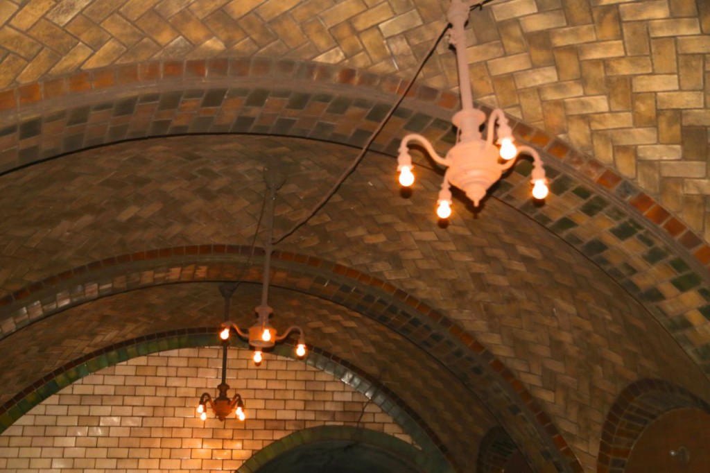 Chandeliers hang from each platform arch