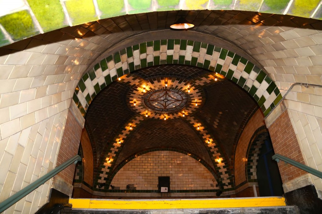 On stairs from platform looking up to mezzanine