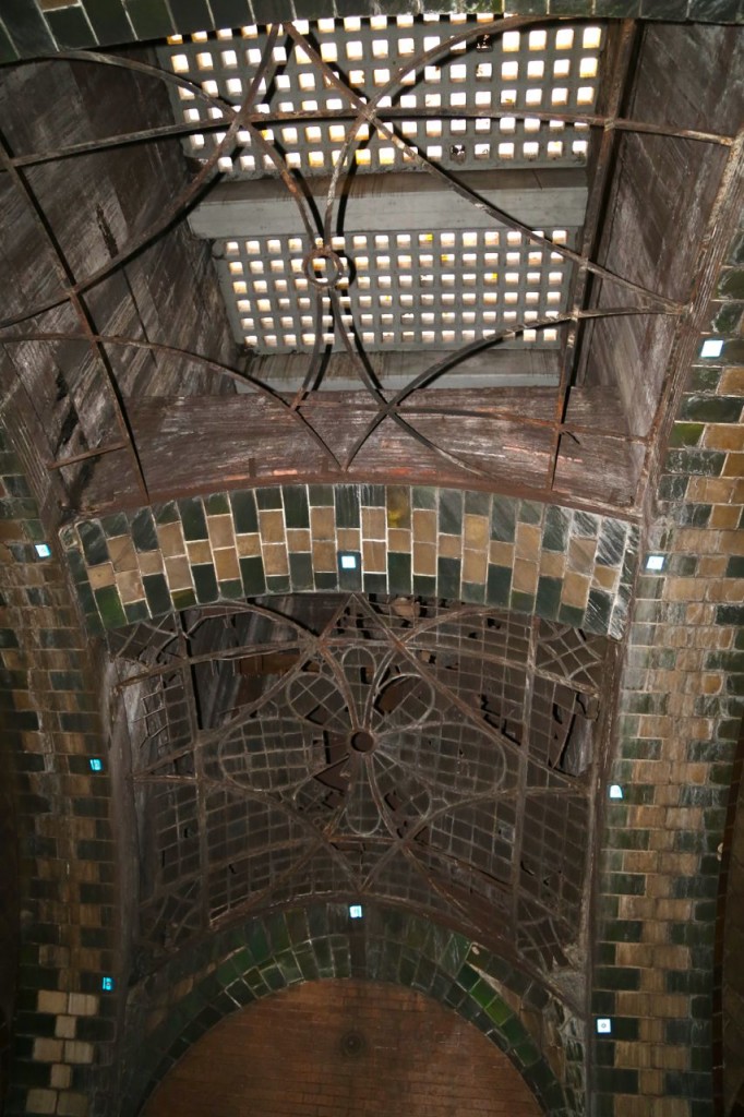 One of the platform's skylights. The glass has fallen out of one of them, and the glass in the street level concrete can be seen.