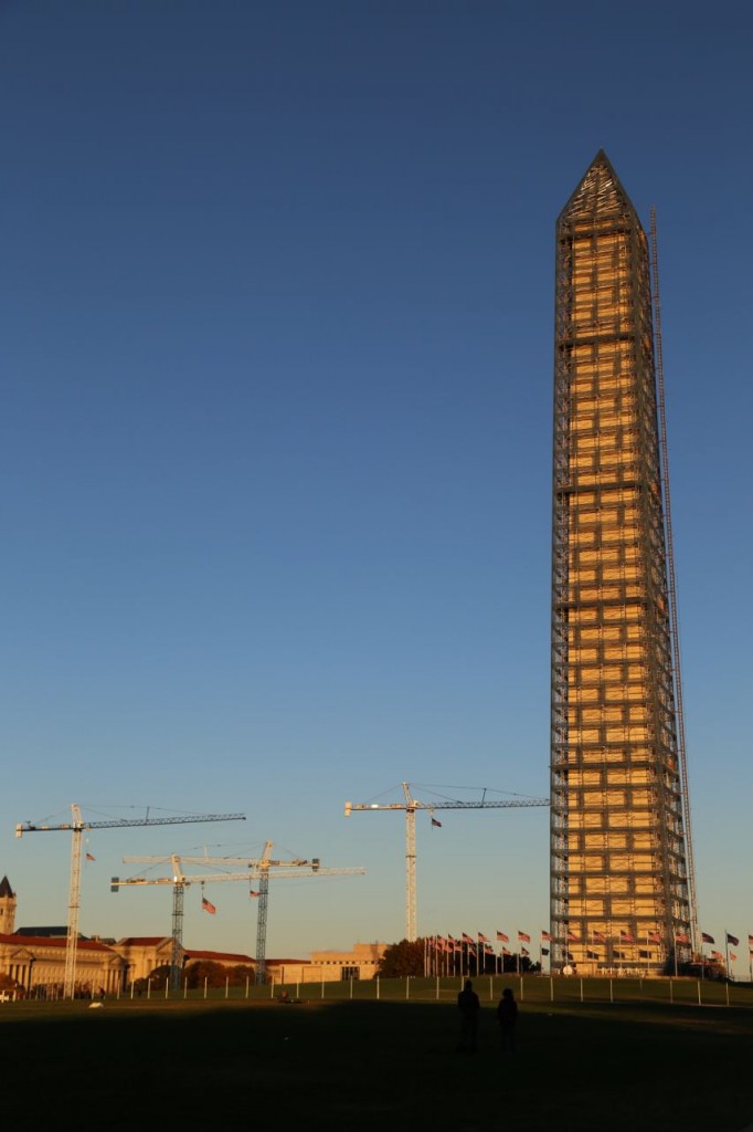 Washington Monument under repair with construction cranes