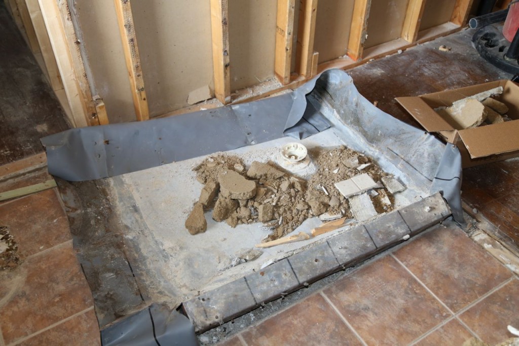 All that is left of the shower, the pan and drain
