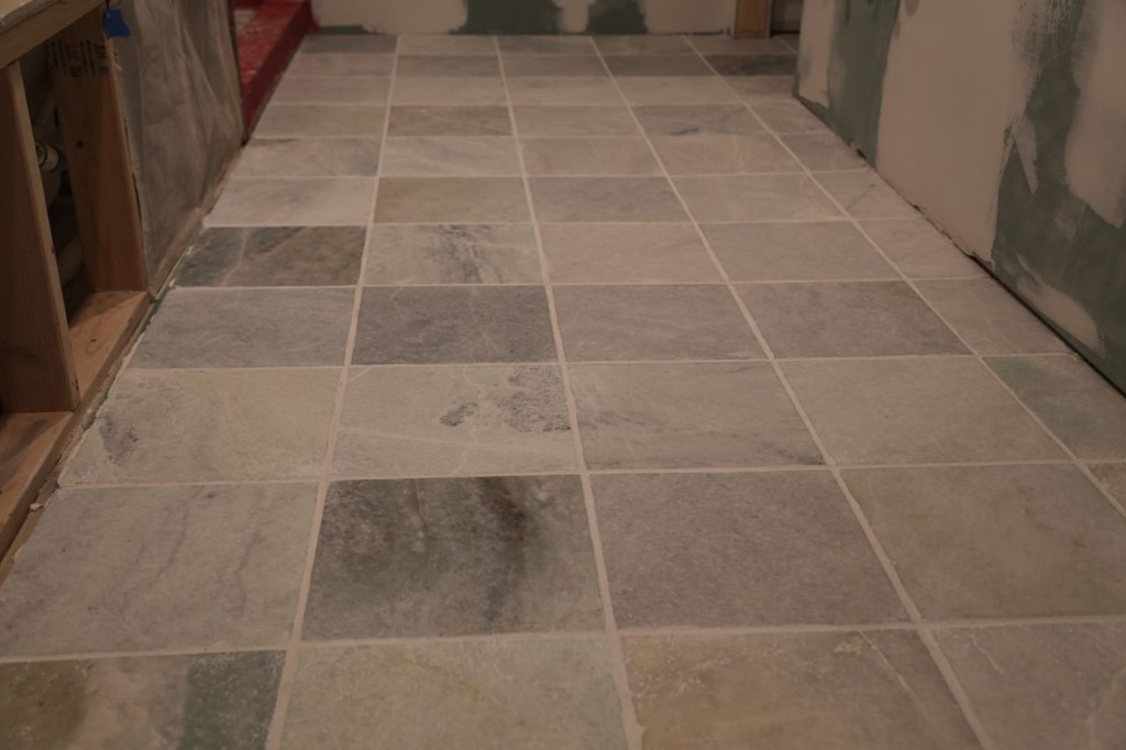 Bathroom floor tile grouted, closer view