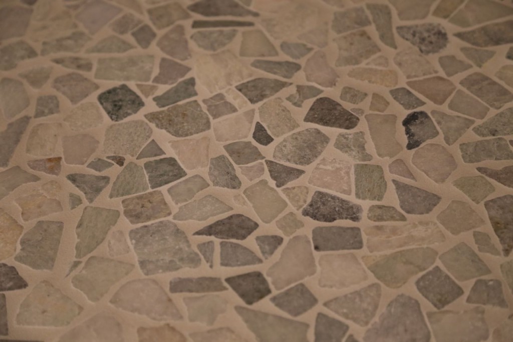 Shower floor tile grouted, closer view