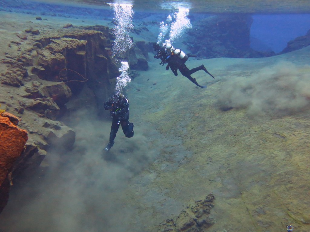 Me taking a photo as the canyon ends in a wider, shallow plane