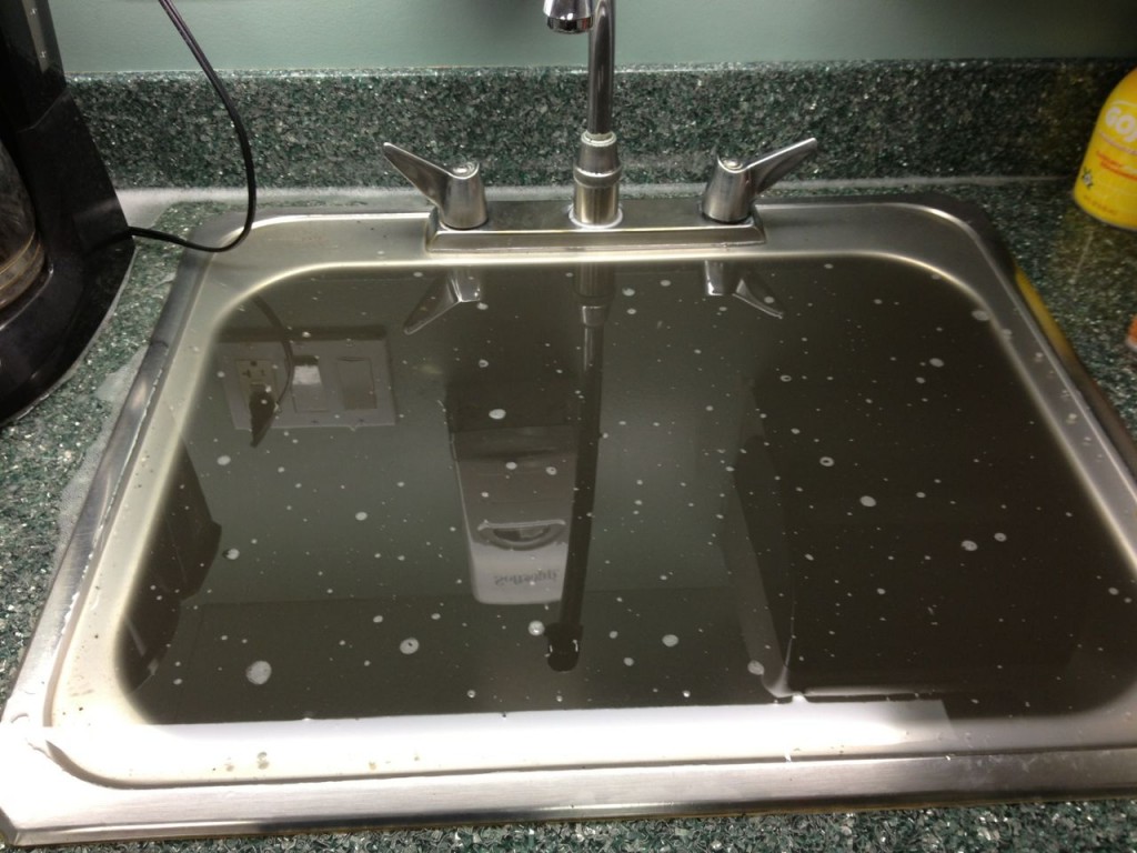 My office's pantry/kitchen sink when it was backed up and overflowing with wastewater. Photo was taken 1/8/2013.