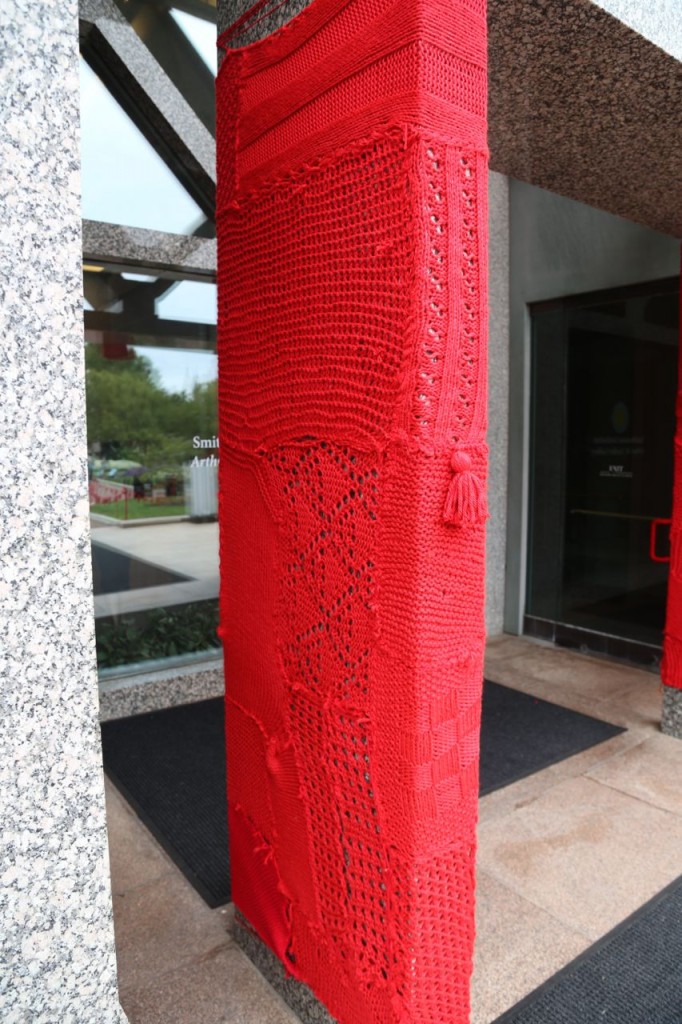 Gallery entrance column yarn bombed 