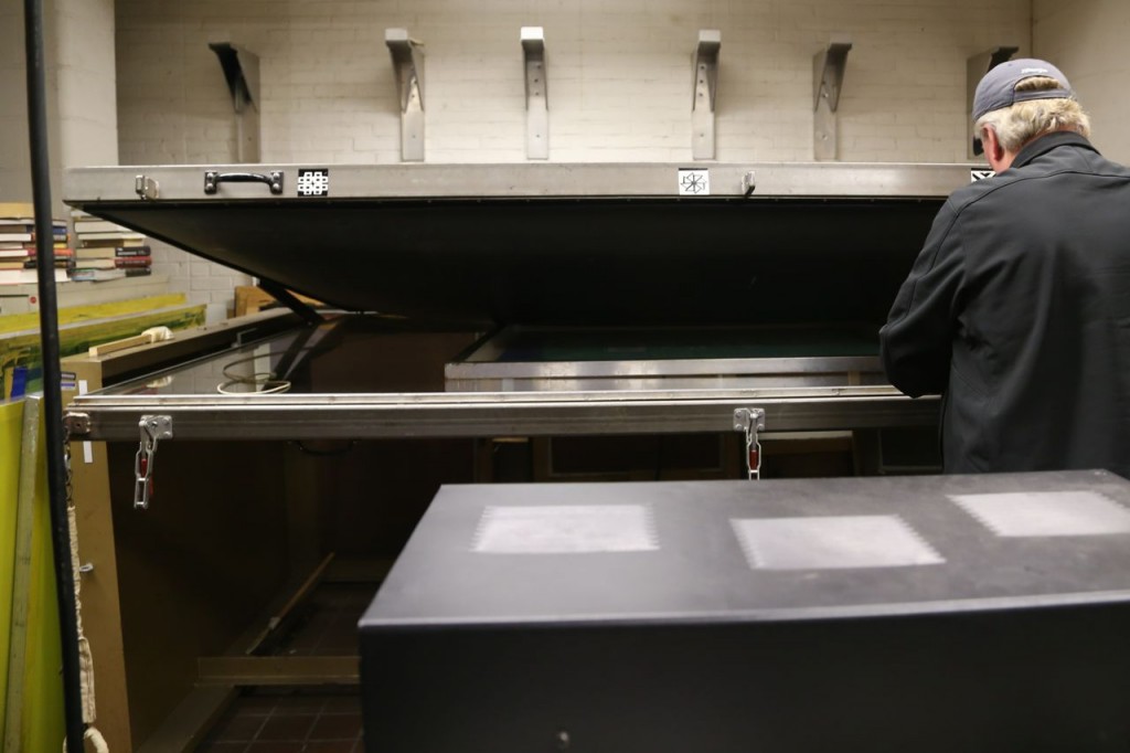 Glass placed into machine where a vacuum will be applied and then it will be treated under ultraviolet light