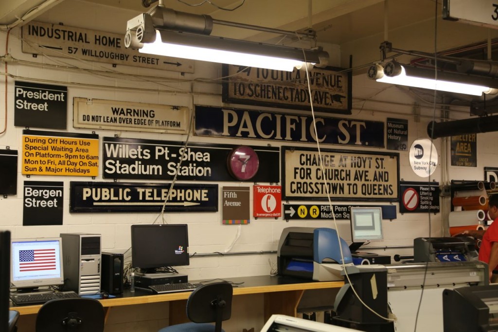 Collection of old signs on the shop's wall