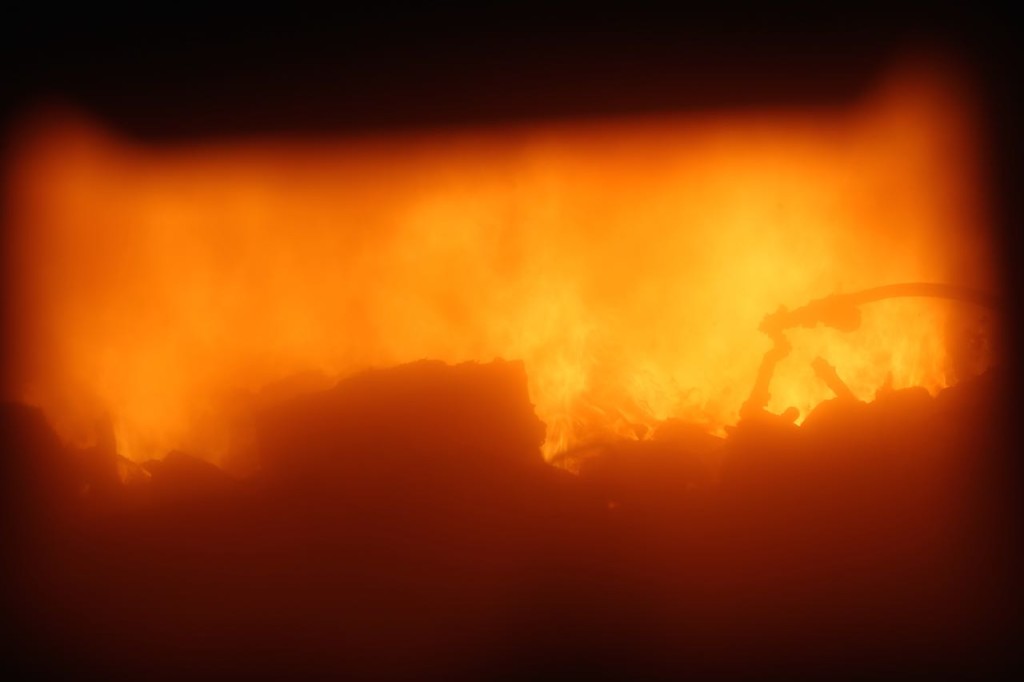 View through a boiler's window of the trash burning