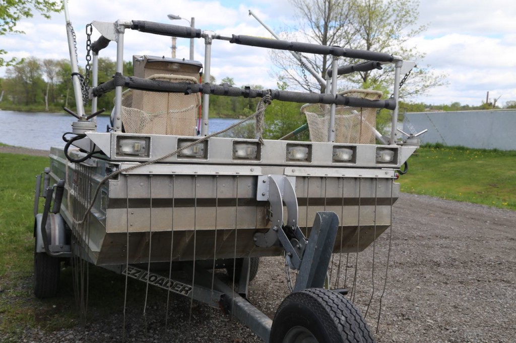 Front of boat, cathode wires hang along bow