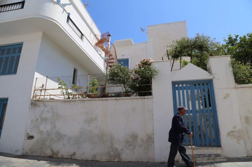 Man walks past gate