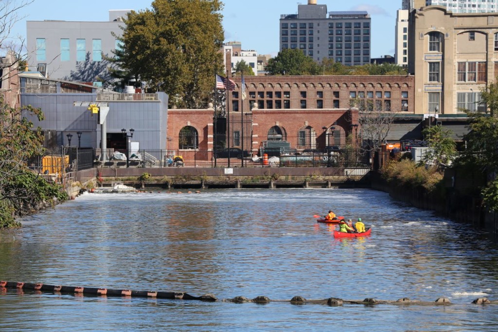 Mr. Swain and his support crew paddled to the start of the Gowanus Canal before he entered the water.