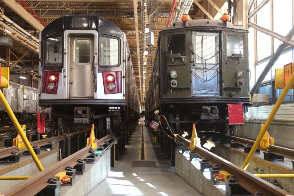 Two trains inside the shop. The one of the right is clearly a vintage one.