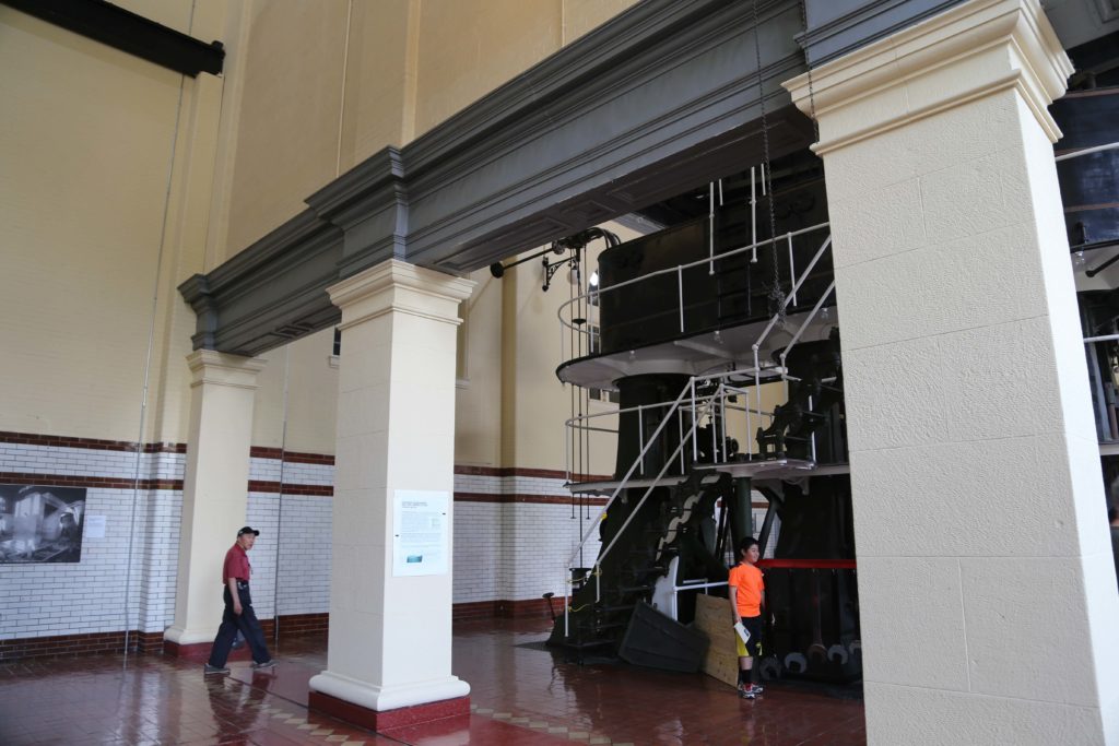 Columns with pressed metal molding and tile on walls