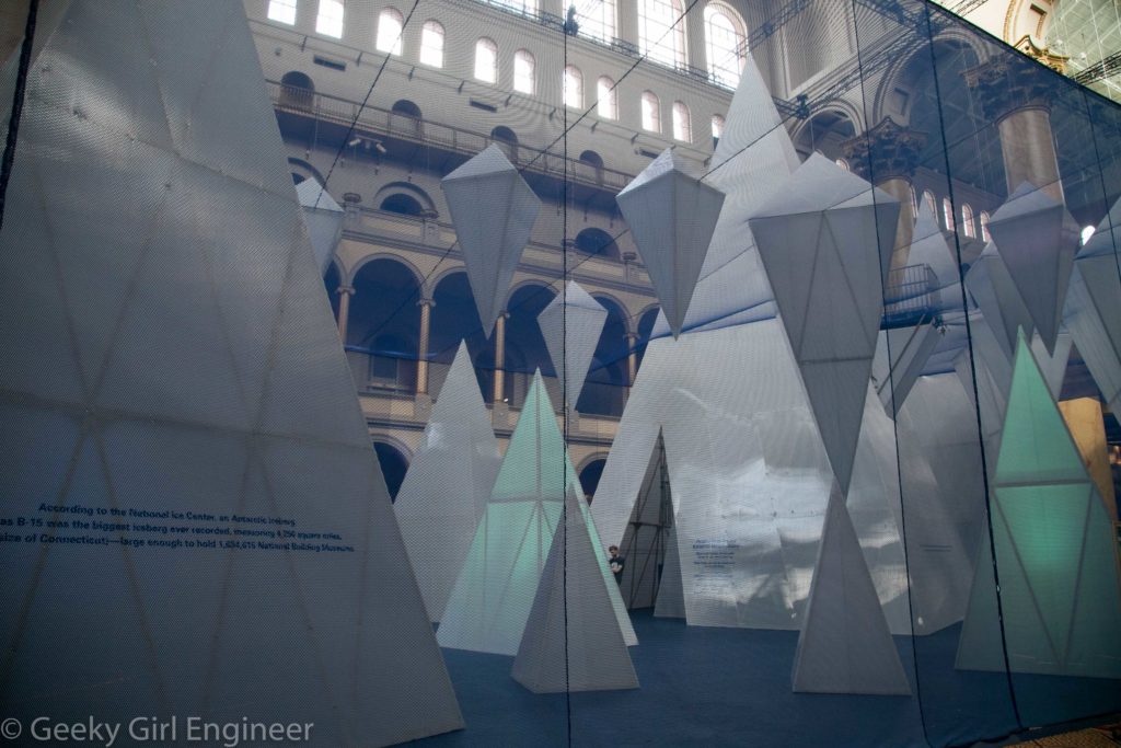 Outside the exhibit, looking through the blue mesh