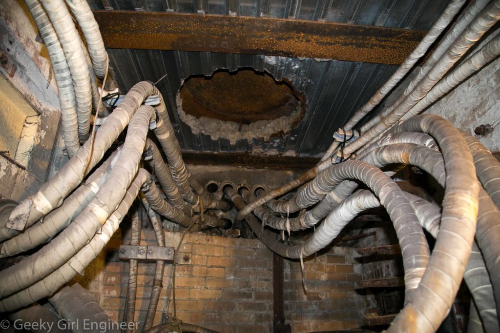 Inside a manhole. The manhole access is visible in the center of the ceiling.