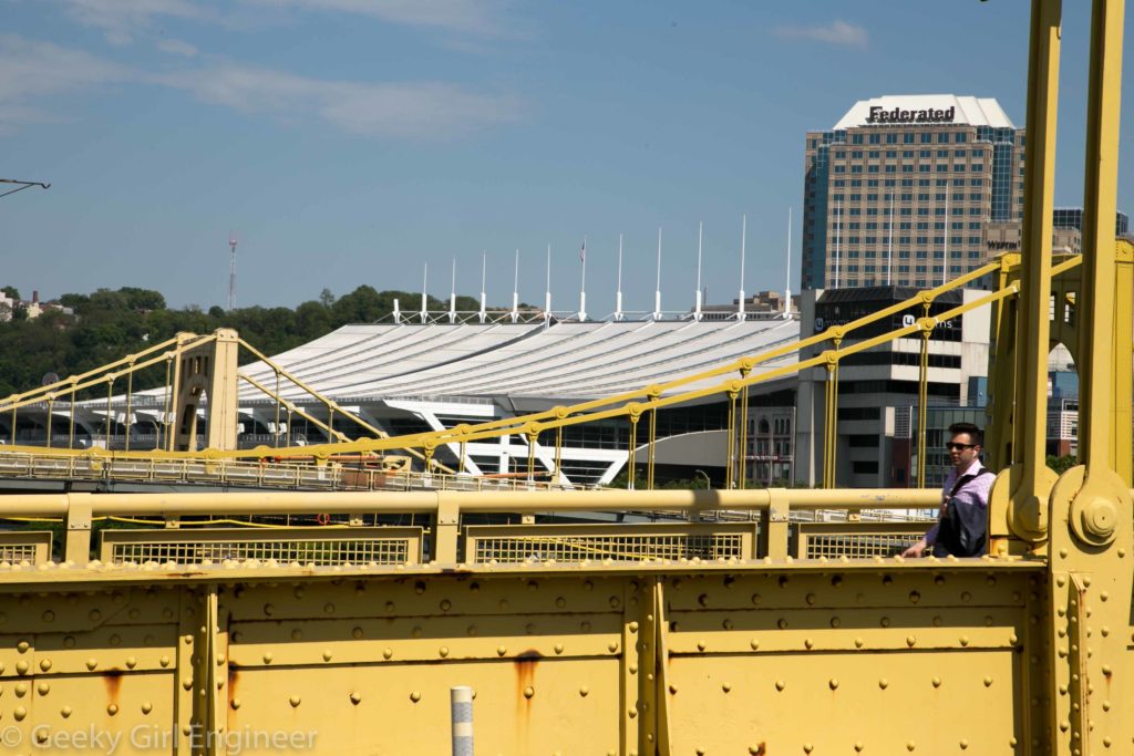 The white in the background is the convention center roof, which I assume was designed to have the same catenary curve as the suspension bridges seen in foreground