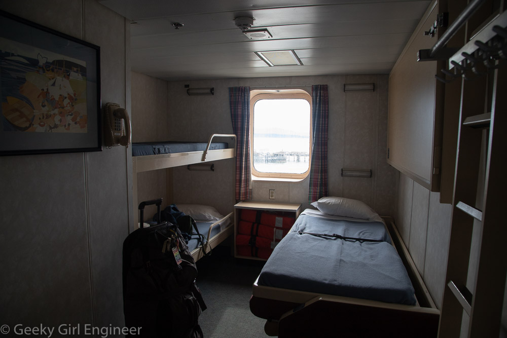 A ship's cabin with bunk beds