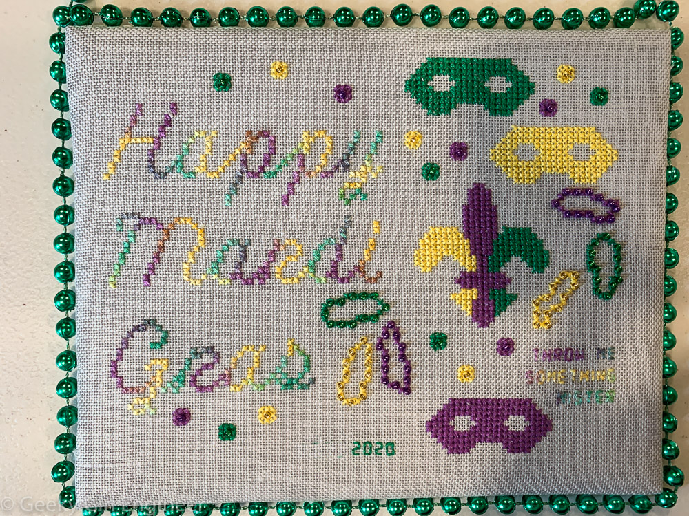 Cross-stitch that says Happy Mardi Gras