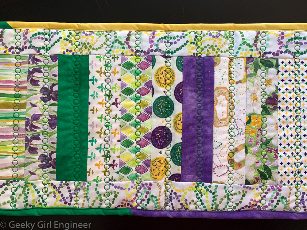 Mardi Gras themed fabric sewed in simple strips